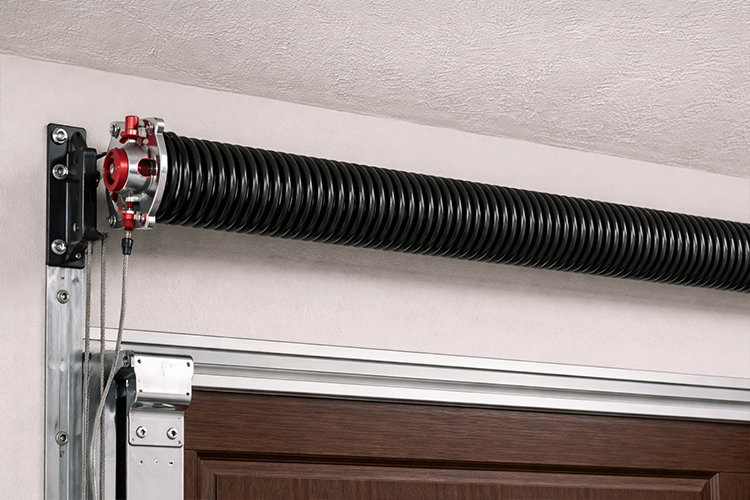 Torsion garage door spring system